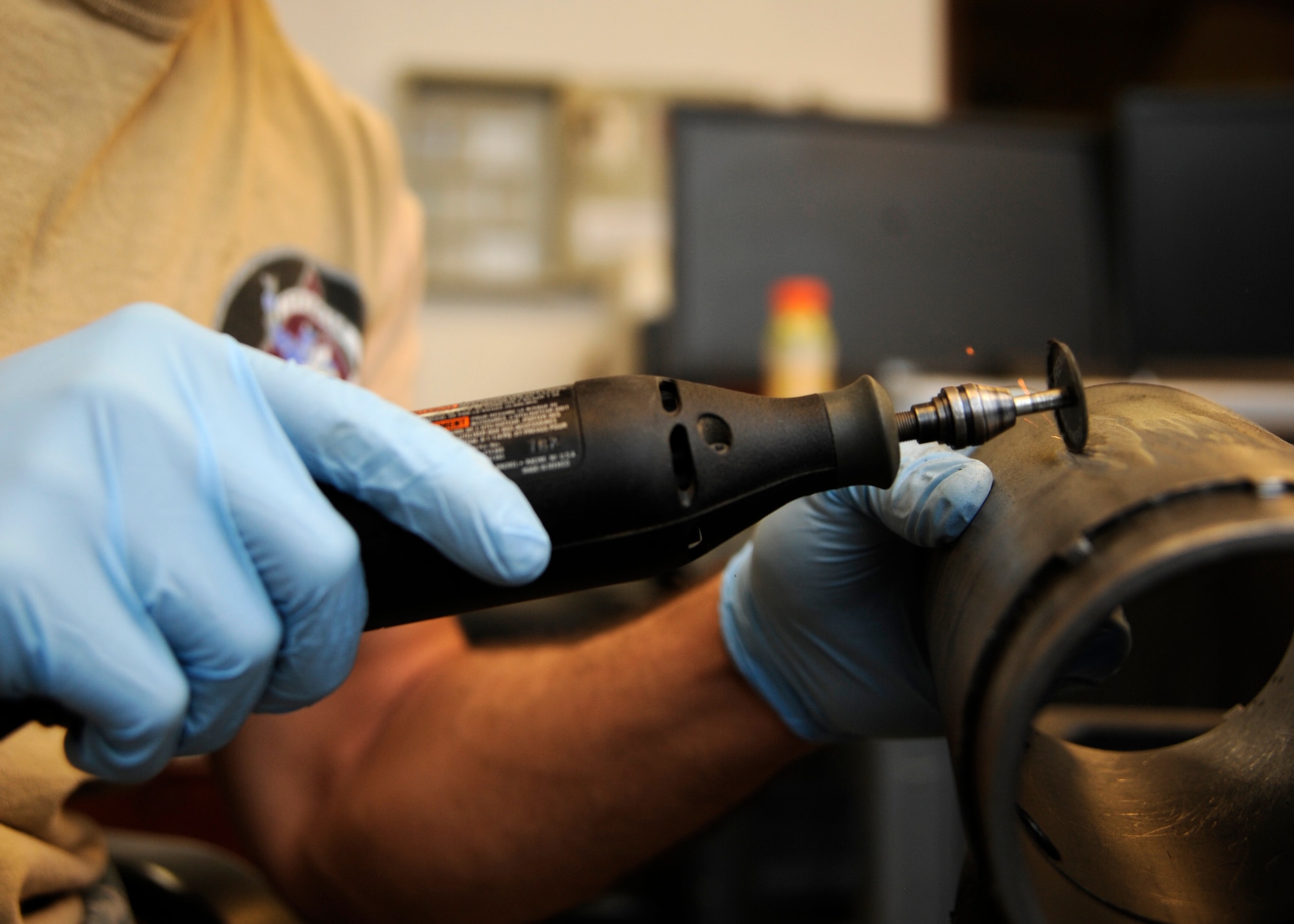 Senior Airman Nathaniel Inman uses a rotary tool to de-etch identification numbers off parts during the final stages of breaking down the 379th Expeditionary Maintenance Squadron propeller centralized repair facility at the 379th Air Expeditionary Wing in Southwest Asia. Oct. 7, 2013. As the 379th Expeditionary Maintenance Squadron propeller CRF closes up shop, any extra equipment specific to the airframe is packaged, tagged and recorded into a computer-based system for other bases with C-130H’s to claim as needed for their operations. Inman is a 379th EMXS propeller CRF aerospace propulsion journeyman deployed from Little Rock Air Force Base, Ark., and hails from Auburn, Wash. (U.S. Air Force photo/Senior Airman Bahja J. Jones) 