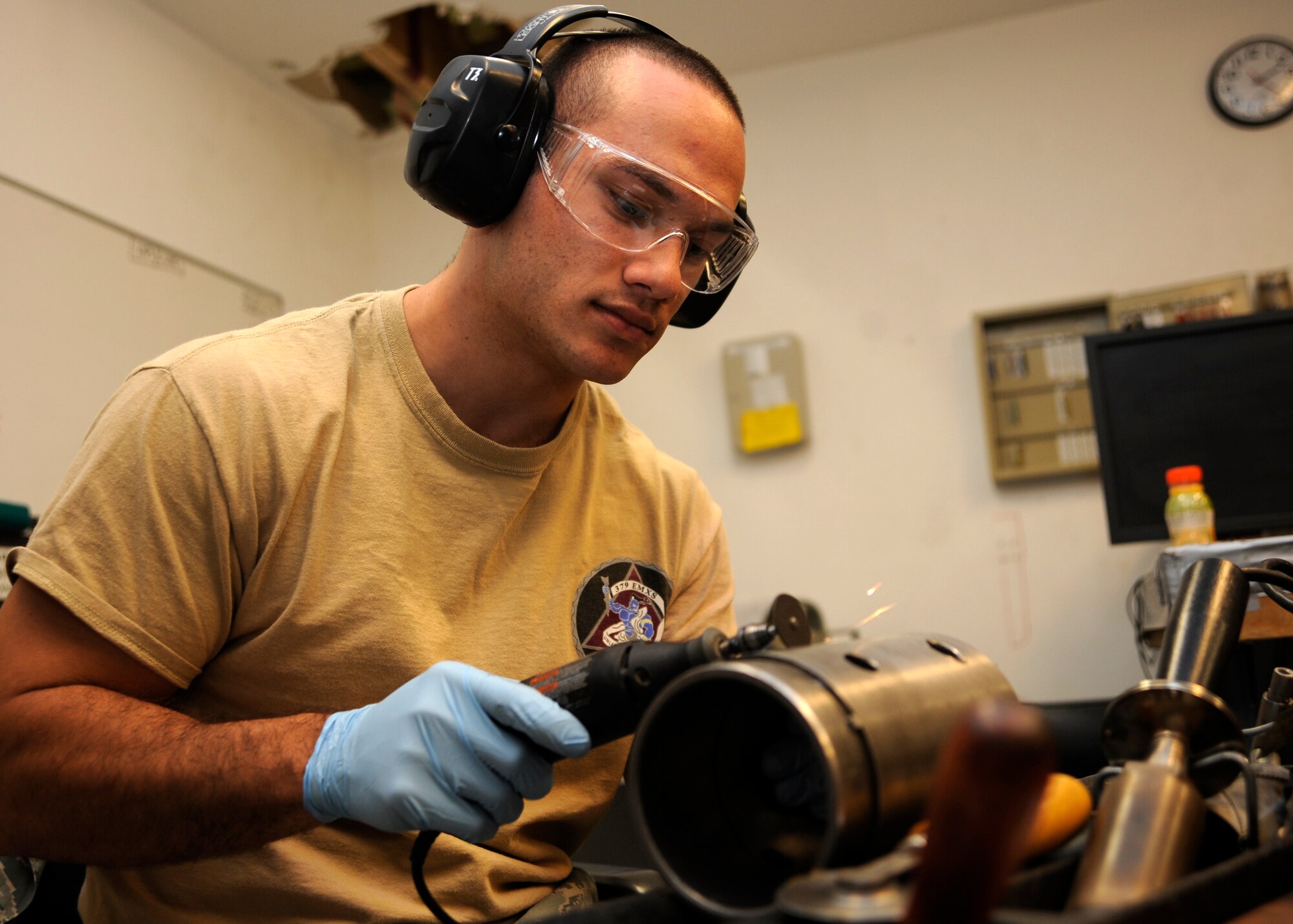 Senior Airman Nathaniel Inman uses a rotary tool to de-etch identification numbers off parts during the final stages of breaking down the 379th Expeditionary Maintenance Squadron propeller centralized repair facility at the 379th Air Expeditionary Wing in Southwest Asia. Oct. 7, 2013. As the 379th Expeditionary Maintenance Squadron propeller CRF closes up shop, any extra equipment specific to the airframe is packaged, tagged and recorded into a computer-based system for other bases with C-130H’s to claim as needed for their operations. Inman is a 379th EMXS propeller CRF aerospace propulsion journeyman deployed from Little Rock Air Force Base, Ark., and hails from Auburn, Wash. (U.S. Air Force photo/Senior Airman Bahja J. Jones) 