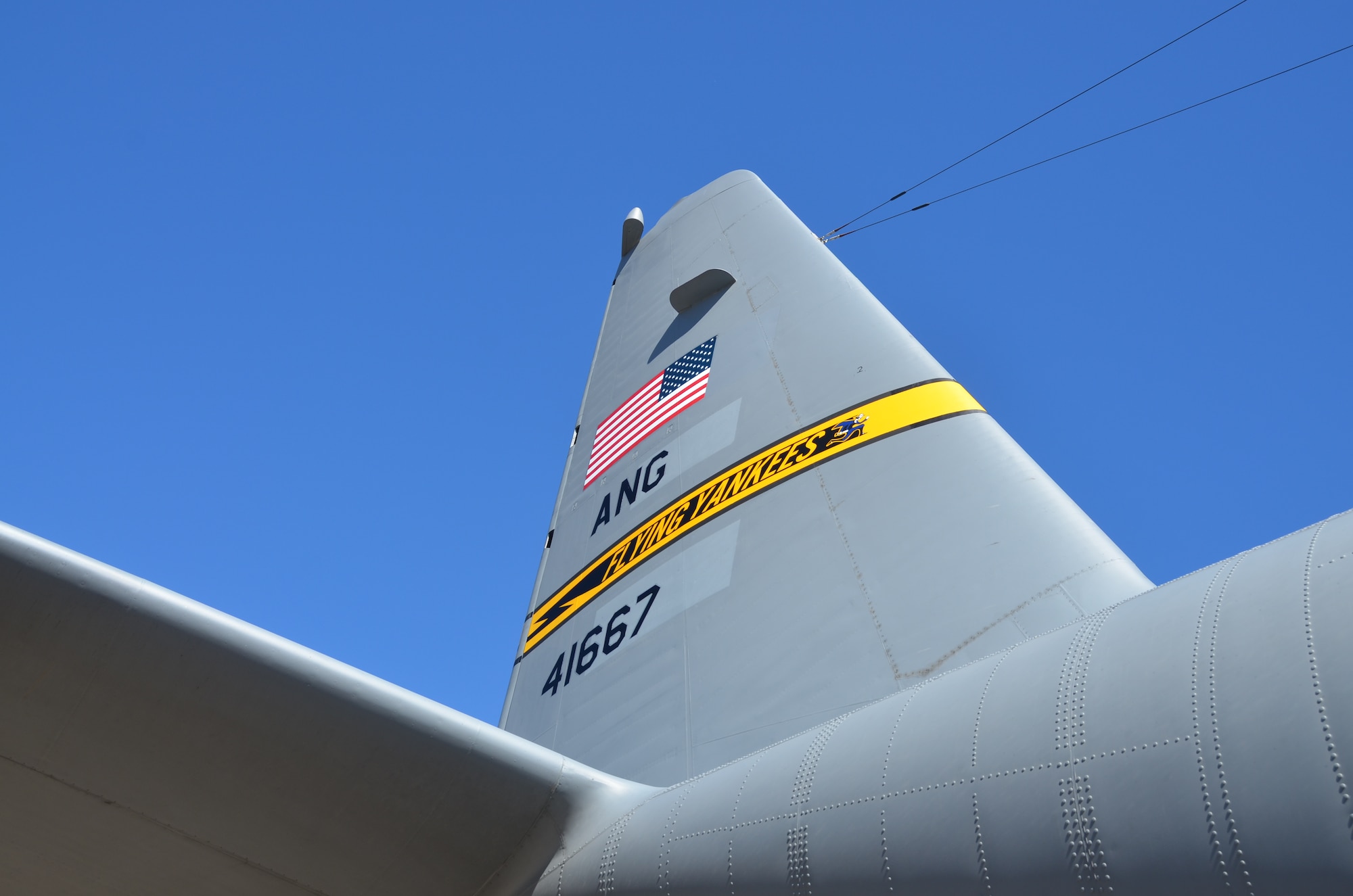 A first look at the new "Flying Yankee" tail flash emblazoned across the vertical stabilizer of the first of eight C-130H aircraft expected to be assigned to the Connecticut Air National Guard moments after it touched down at Bradley International Airport, Windsor Locks, Conn., Tuesday, Sept. 24, 2013. (U.S. Air National Guard photo by Maj. Jefferson Heiland)