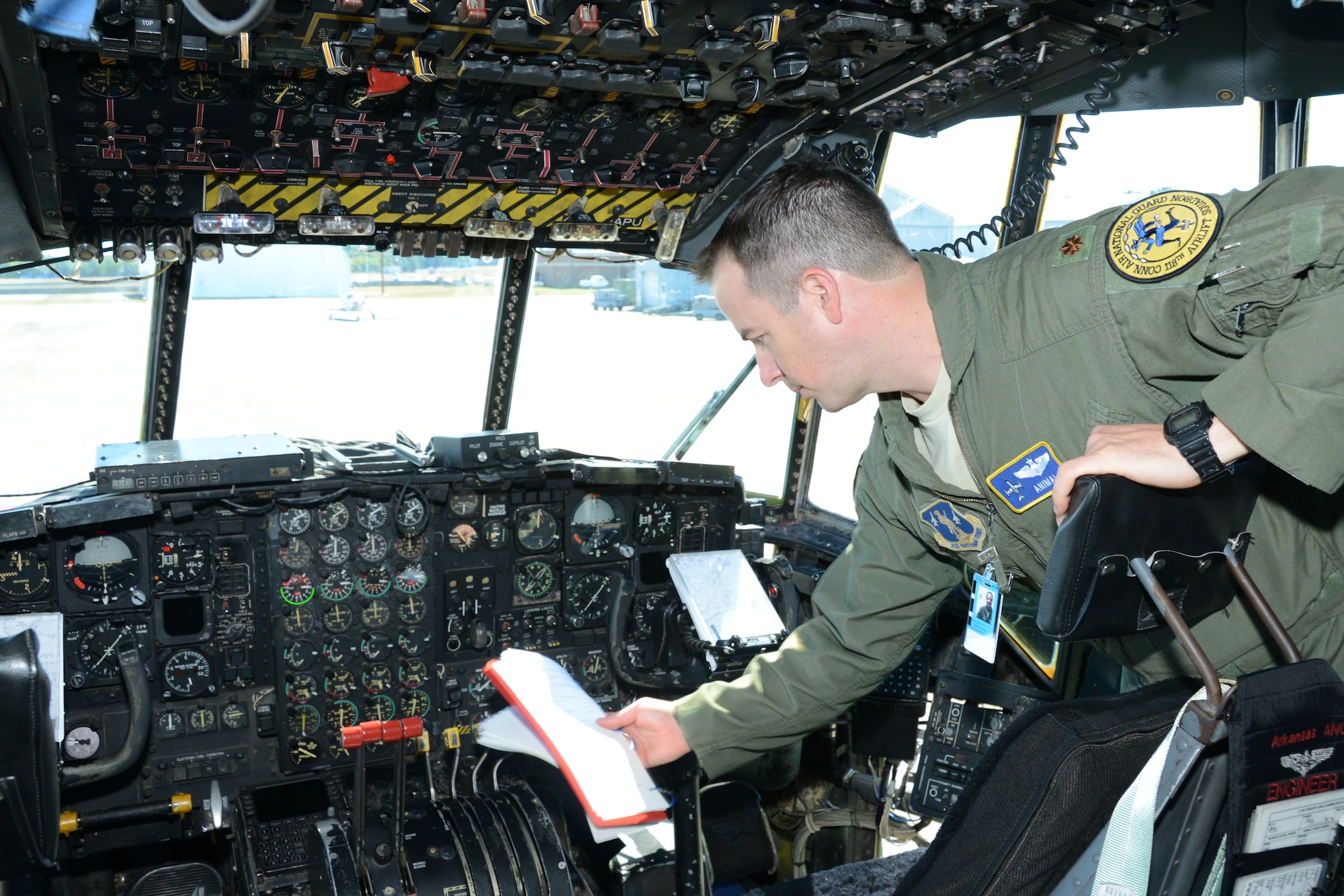 Maj. Christopher Papa, a pilot assigned to the 118th Airlift Squadron, inspects the cockpit of the first of eight C-130H aircraft expected to be assigned to the Connecticut Air National Guard’s 103rd Airlift Wing moments after it touched down at Bradley International Airport, Windsor Locks, Conn., Tuesday, Sept. 24, 2013. (U.S. Air National Guard photo by Master Sgt. Erin McNamara)