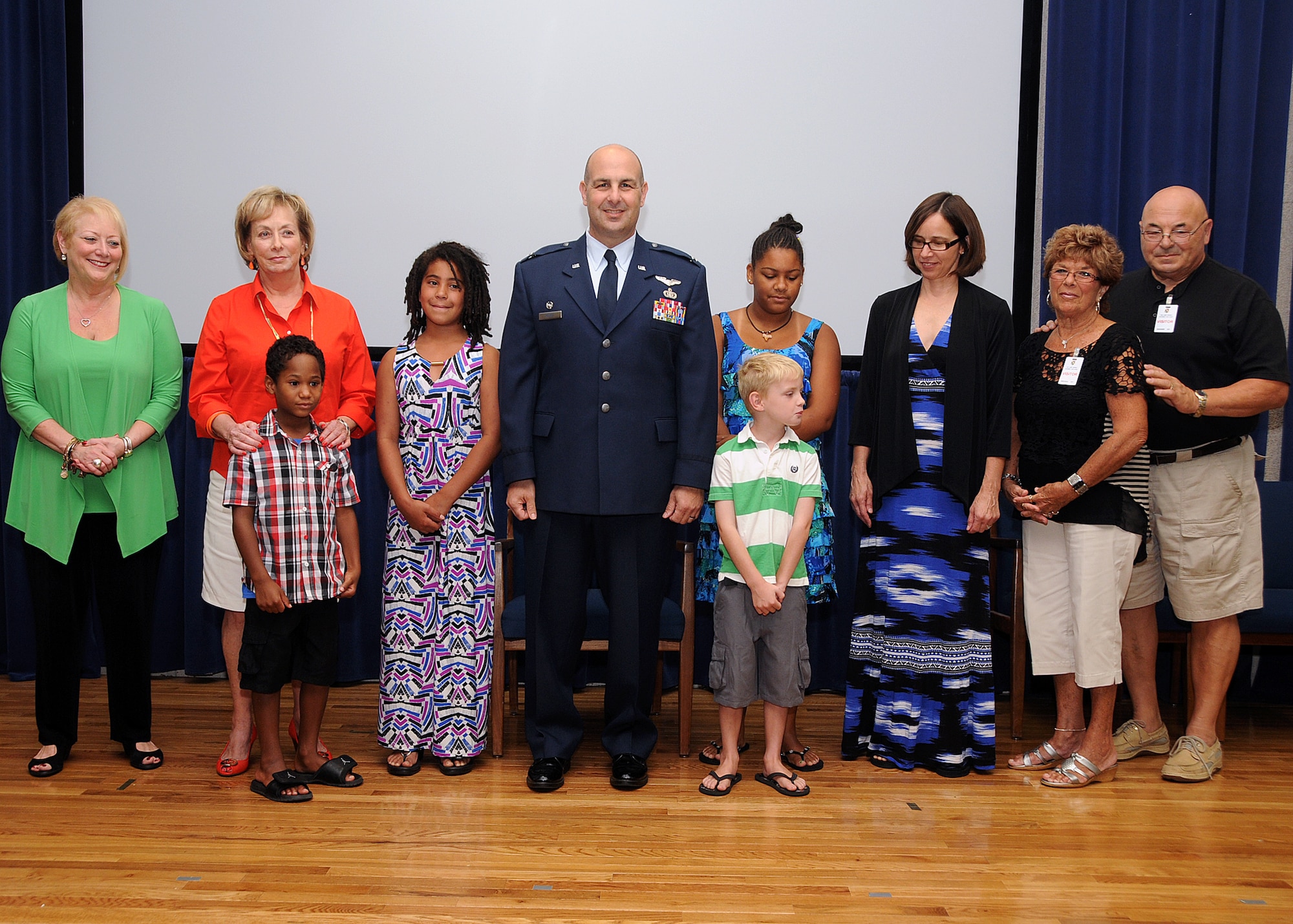 Colonel Anthony Hamel, Commander, 143d Mission Support Group, and his family pose for a photo following his pinning to Colonel. National Guard photo by Master Sgt Janeen Miller
