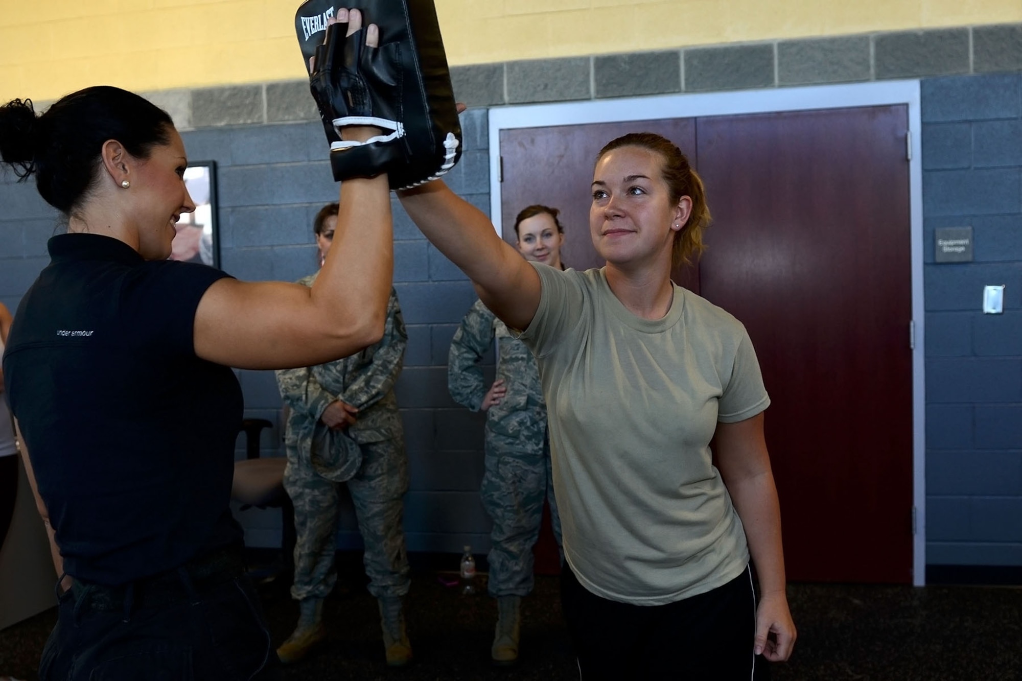 U.S. Air Force Senior Airman Terra Brice, a crew chief with the 169th Aircraft Maintenance Squadron at McEntire Joint National Guard Base, South Carolina Air National Guard, demonstrates a self-defense tactic taught by Lance Cpl. Aubree Torres, a training police officer with the Richland County Sheriff’s Department, Oct. 6, 2013. Airmen assigned to the 169th Fighter Wing participate in a “females only” self-defense class provided by Richland County Sheriff’s Department.  (U.S. Air National Guard photo by Tech. Sgt. Caycee Watson/Released)