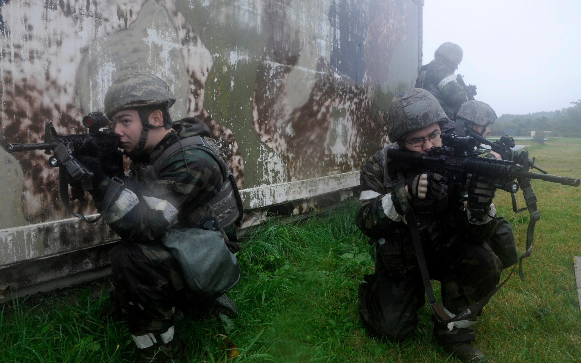 Airmen from the 35th Security Forces Squadron perform combat tactics training during an Operational Readiness Exercise at Misawa Air Base, Japan, Oct. 9, 2013. The Airmen must undergo a wide array of training such as self-aid and buddy care, combat tactics and improvised explosive device identification. (U.S. Air Force photo by Airman 1st Class Kaleb Snay)