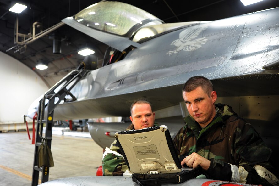 Staff Sgt. Chance Cunningham, right, 35th Aircraft Maintenance Squadron, performs diagnostic checks on an F-16 Fighting Falcon during an Operational Readiness Exercise at Misawa Air Base, Japan, Oct. 9, 2013. Cunningham is an electrical & engineering systems maintainer who has been at Misawa for more than two years. (U.S. Air Force photo by Senior Airman Derek VanHorn)