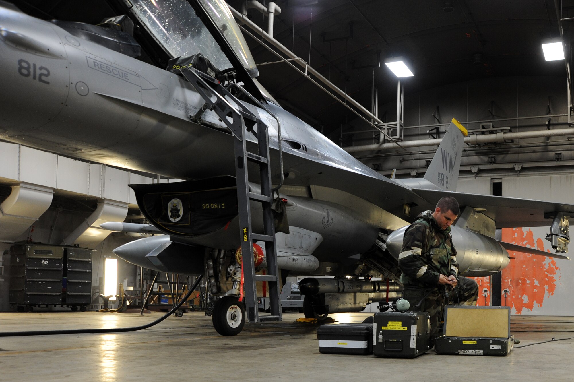 Staff Sgt. Chance Cunningham, 35th Aircraft Maintenance Squadron, prepares to switch out a wing fuel tank on an F-16 Fighting Falcon at Misawa Air Base, Japan, Oct. 9, 2013. Airmen from the 35th Fighter Wing were put through various simulated attacks and scenarios during an Operational Readiness Exercise that tested their ability to respond in wartime operations. (U. S. Air Force photo by Senior Airman Derek VanHorn)