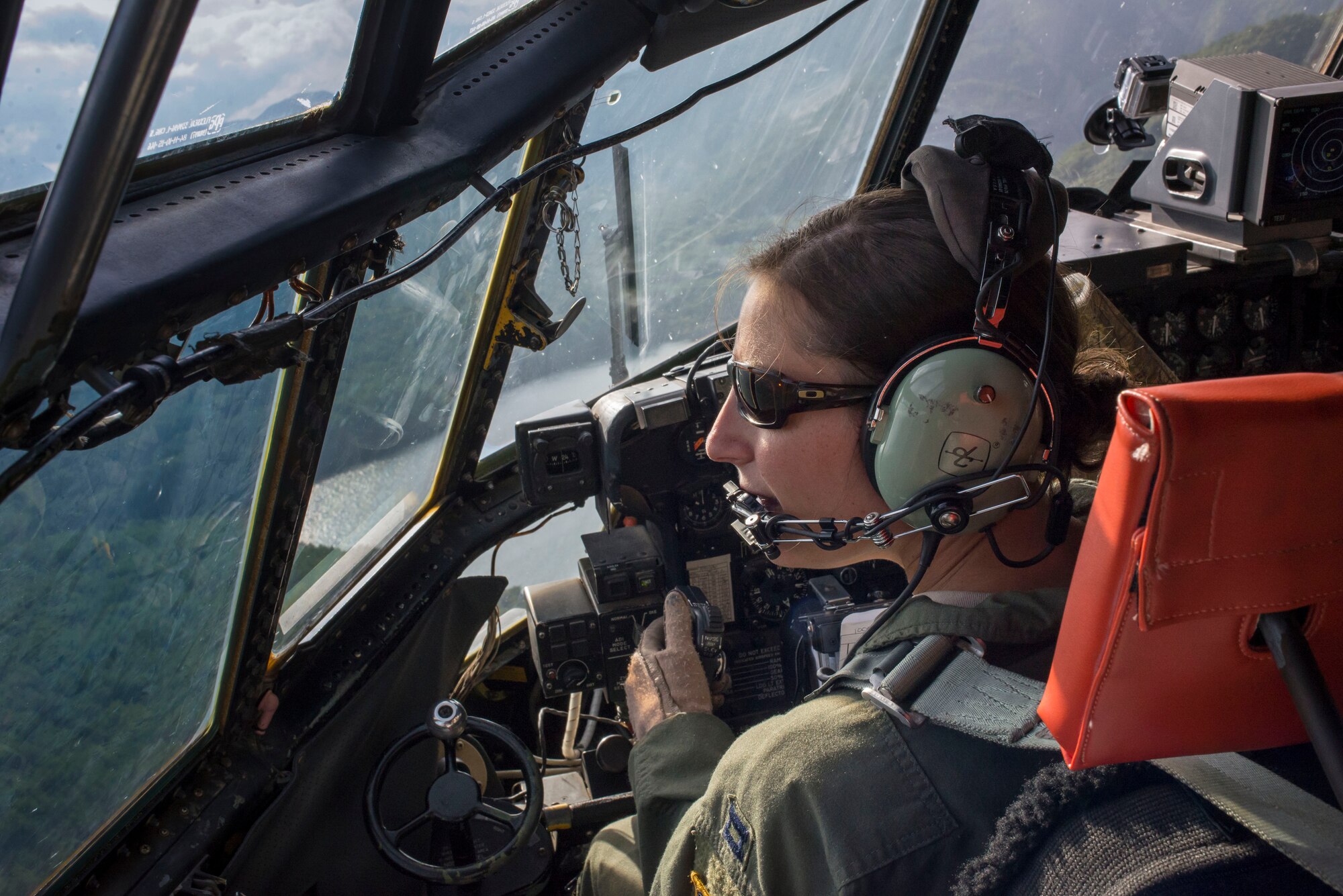 Capt. Taylor Rigollet, 36th Airlift Squadron pilot, flies a C-130 Hercules during a training mission as part of Readiness Week at Yokota Air Base, Japan, Oct. 8, 2013. Readiness week is designed to help Yokota Airmen hone their skills through a series of training scenarios events and exercises. (U.S. Air Force photo by Captain Raymond Geoffroy/Released)