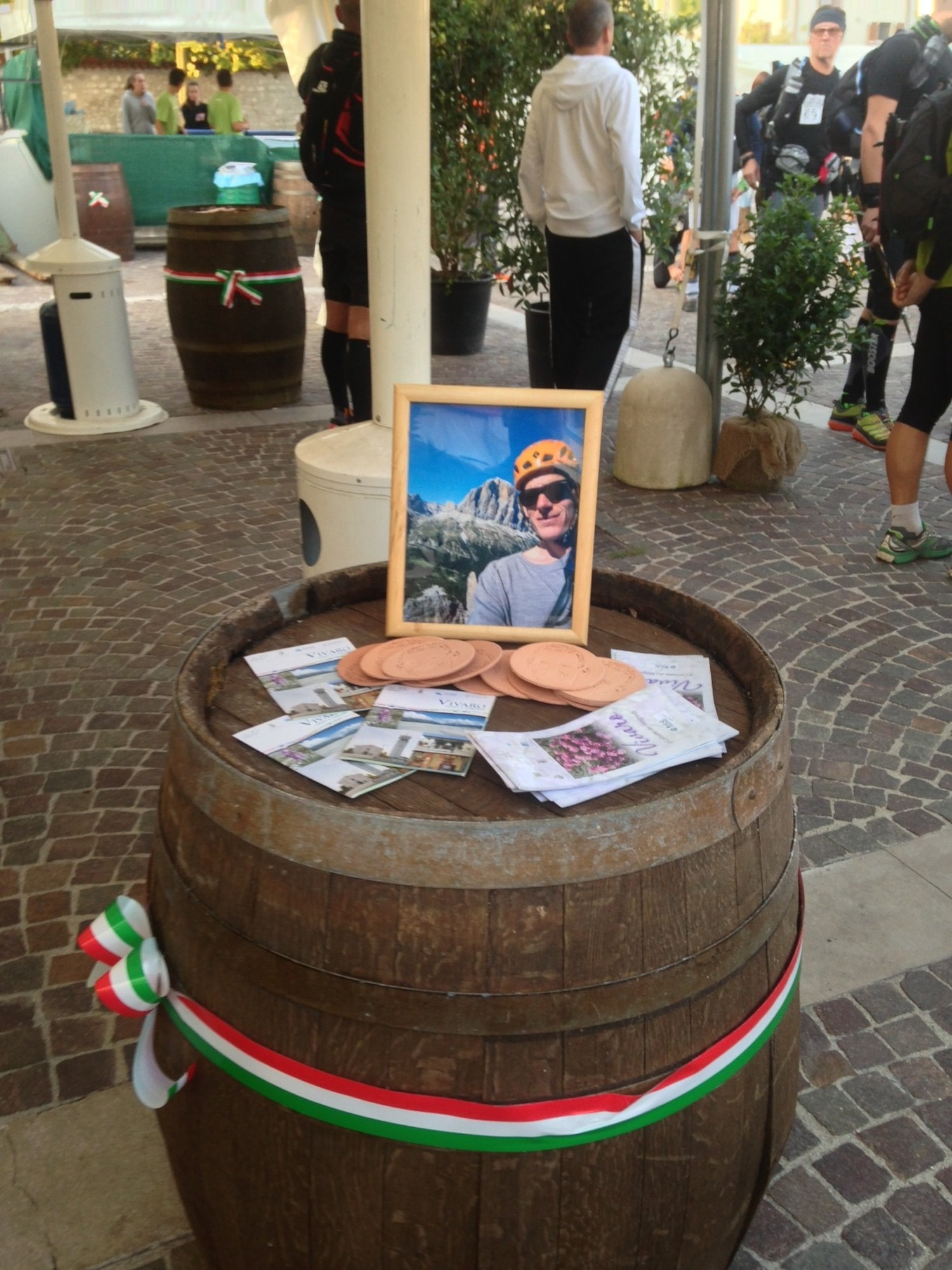 A photo of Major Lucas 'Gaza' Gruenther is displayed on a barrel at the start of the Magredi 100-mile Ultra Trail Run Oct 5, 2013, at Vivaro, Italy. Gruenther was an F-16 pilot who lost his life Jan. 28  during a training mission at Aviano Air Base, Italy. (Courtesy Photo)