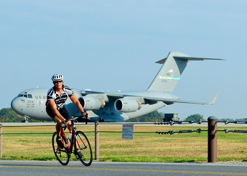 Master Sgt. Matthew Vogt, 436th Aircraft Maintenance Squadron, rounds a turn during the Dover Air Force Base Duathlon on Dover AFB, Del., Oct. 5, 2013. The duathlon consisted of a 5K run, then transitioned to a 10.3 mile bicycle ride, and ended with an additional 5K run. (U.S. Air Force photo/Airman 1st Class William Johnson)