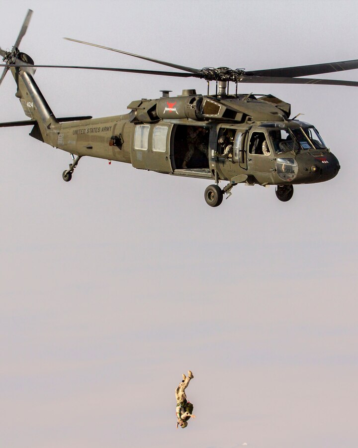 U.S. Marines assigned to Force Reconnaissance Platoon, Maritime Raid Force, 26th Marine Expeditionary Unit (MEU), conduct military freefall parachute operations from UH-60 Black Hawks assigned to Alpha Company, 1-189th General Support Aviation Battalion (GSAB) from the Montana Army National Guard in the U.S. 5th Fleet area of responsibility, Sept. 5, 2013. The 26th MEU is a Marine Air-Ground Task Force forward-deployed to the U.S. 5th and 6th Fleet areas of responsibility aboard the Kearsarge Amphibious Ready Group serving as a sea-based, expeditionary crisis response force capable of conducting amphibious operations across the full range of military operations. (U.S. Marine Corps photo by Sgt. Christopher Q. Stone, 26th MEU Combat Camera/Released)