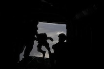 Marines from 2nd Force Reconnaissance Battalion prepare to jump out of an MV-22B Osprey as part of their parachute operations, Sept. 26. The operation was being conducted as training for the jumpers and acted at practical application for the pilots and crew chiefs.