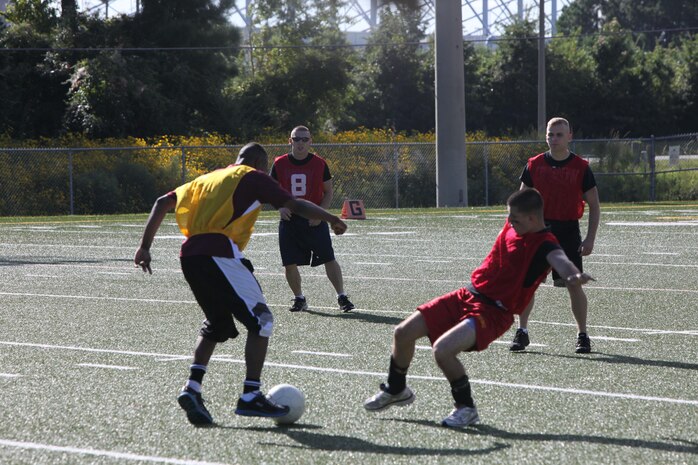 Marines from Headquarters and Headquarters Squadron aboard Marine Corps Air Station New River took part in the CommanderÕs Cup soccer tournament, Sept. 27. The CommanderÕs Cup tournaments are held as a squadron fundraiser to aid in the price of their Marine Corps Birthday Ball tickets.