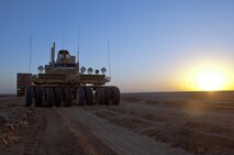 A Mine Resistant, Ambush Protected vehicle faces down a desert road during a combat logistics patrol conducted by Marines with Combat Logistics Regiment 2, Regional Command (Southwest), in Helmand province, Afghanistan, Oct. 2, 2013. The Marines completed a four-day mission to move equipment and supplies between Camp Dwyer and Camp Leatherneck, Afghanistan.