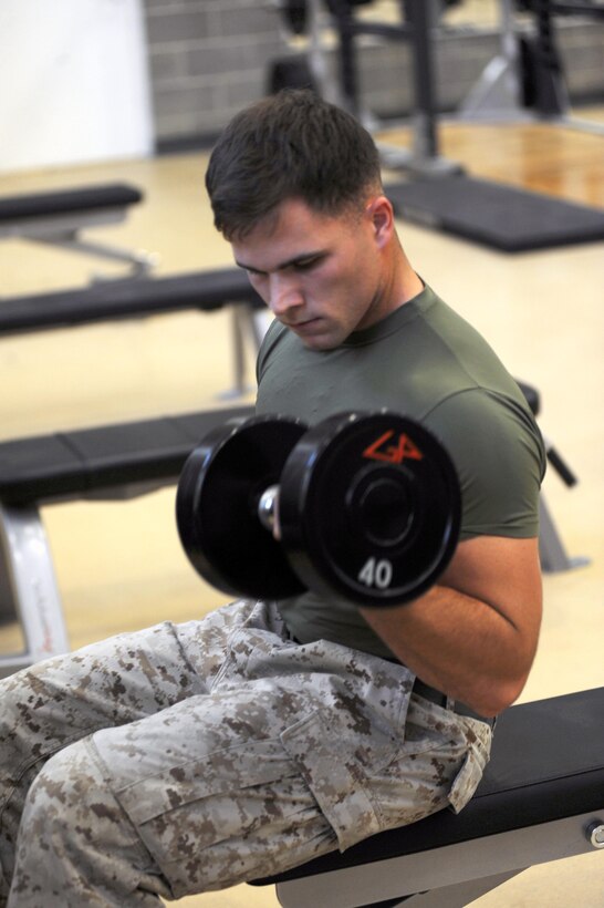 Cpl. Blake Hendricks demonstrates use of new weights on the equipment floor of the Wallace Creek Fitness Center aboard Marine Corps Base Camp Lejeune, Oct. 2. 

