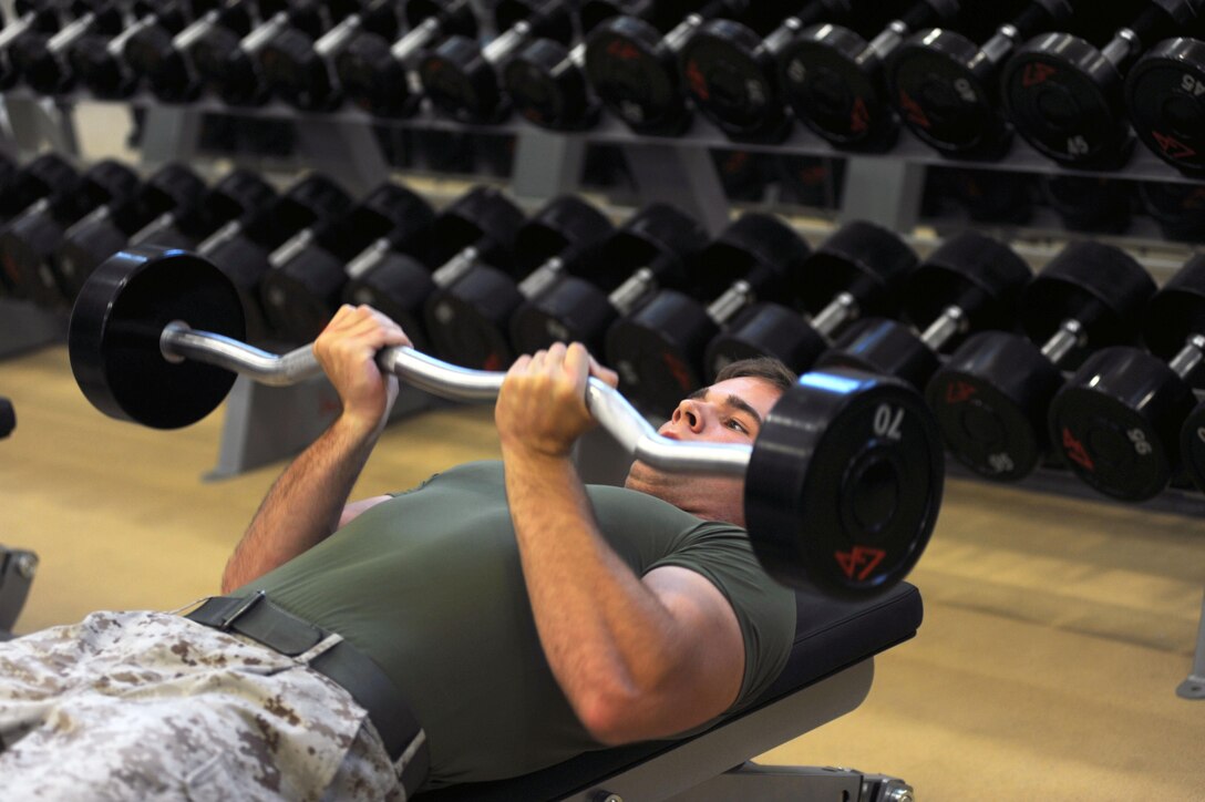 Cpl. Blake Hendricks demonstrates use of new weights on the equipment floor of the Wallace Creek Fitness Center aboard Marine Corps Base Camp Lejeune, Oct. 2.