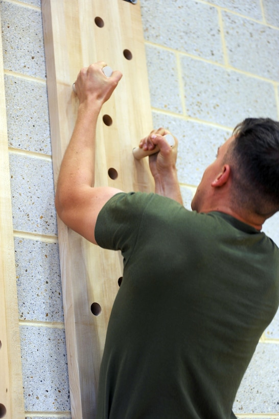 Lance Cpl. Benjamin Hanna tests the new equipment at the Wallace Creek Fitness Center aboard Marine Corps Base Camp Lejeune, Oct. 9. The highly anticipated opening of Wallace Creek will include a ribbon cutting, product expo, massage therapist and group fitness classes.

