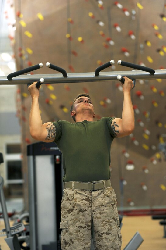 Lance Cpl. Benjamin Hanna tests the new equipment at the Wallace Creek Fitness Center aboard Marine Corps Base Camp Lejeune, Oct. 9. The highly anticipated opening of Wallace Creek will include a ribbon cutting, product expo, massage therapist and group fitness classes.
