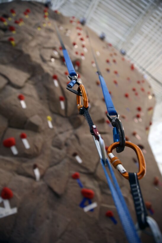 Belay lines for the rock climbing wall rest in their ready positions in the Wallace Creek Fitness Center aboard Marine Corps Base Camp Lejeune, Oct. 7. The fitness center has the only indoor rock climbing wall aboard Camp Lejeune.