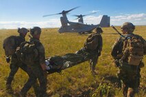 U.S. Marines fron 2nd Marine Special Operations Battalion (MSOB) extract U.S. Navy Lieutenant Commander Tim Welsh during a Tactial Recovery of Aircraft Personnel exercise near Coloardo Springs, Colo. Sept. 21, 2013. The purpose of this exercise was to test the fleet readiness of the Marine Vessel-22B's bi-annual software update. 