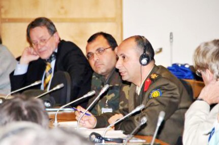 Egyptian Col. Ayman Kishar, center-right, makes a point to speaker Magda Kandil, executive director and director of research of the Egyptian Center for Economic Studies, during a panel discussion about the 'Arab Spring' during a seminar held at the George C. Marshall European Center for Security Studies in Garmish-PartenKirchen, Germany. Kishar is one of 97 participants attending the Jan. 18 to 26 seminar.