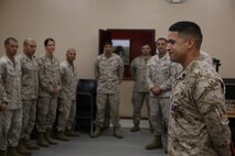 Sgt. Julian Bejarano Jr., a mortarman with the Battle Skills Training School, Combat Logistics Regiment 27, 2nd Marine Logistics Group and Purple Heart Medal recipient, addresses a formation of Marines and sailors during a Purple Heart award ceremony aboard Camp Lejeune, N.C., Oct. 8, 2013. Bejarano sustained wounds from an improvised explosive device blast during a resupply convoy in Helmand province, Afghanistan, July 5, 2013. 