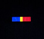 The Alaska National Guard State Partnership Program Ribbon is divided into three vertical sections of blue, gold and red, representing the significance of the partnership between Alaska and the Republic of Mongolia by representing the colors of each of their flags. The blue represents the eternal skies expanding above both nations, the red symbolizes progress and prosperity and the gold signifies wealth.