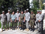 A group of Citizen-Soldiers and -Airmen from the Virginia National Guard meet with the commander of the PKO battallion and some of his staff members during a trip to Tajikistan, June 13 to 19, 2011.