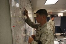 Marines with 6th Marine Regiment, 2nd Marine Division, conduct a training command post exercise Sept. 18, 2013, inside the II Marine Expeditionary Force Simulation Center aboard Marine Corps Base Camp Lejeune. "Having been in COCs (command operation centers) before in Afghanistan, it is amazing how many similarities are right [in our simulated exercise]," said Maj. Kemper Jones, the operations officer with 6th Marines, from Richmond, Va.