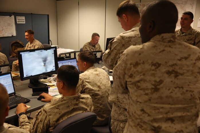 Marines with 6th Marine Regiment, 2nd Marine Division, conduct a training command post exercise Sept. 18, 2013, inside the II Marine Expeditionary Force Simulation Center aboard Marine Corps Base Camp Lejeune. "Having been in COCs (command operation centers) before in Afghanistan, it is amazing how many similarities are right [in our simulated exercise]," said Maj. Kemper Jones, the operations officer with 6th Marines, from Richmond, Va.