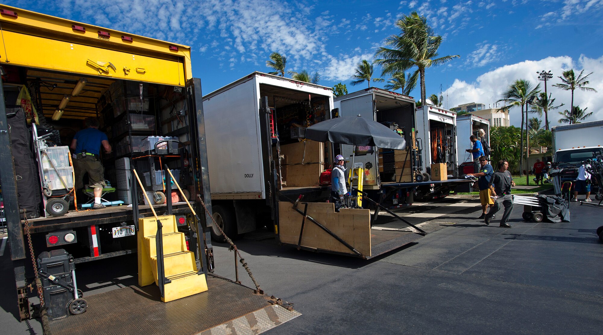 “Hawaii Five-0” production crew members load their camera equipment at the conclusion of filming a scene on the flightline at Joint Base Pearl Harbor-Hickam, Oct. 9, 2013. The crew and cast were on scene to shoot a portion of an upcoming episode. (U.S. Air Force photo/Tech. Sgt. Jerome S. Tayborn)