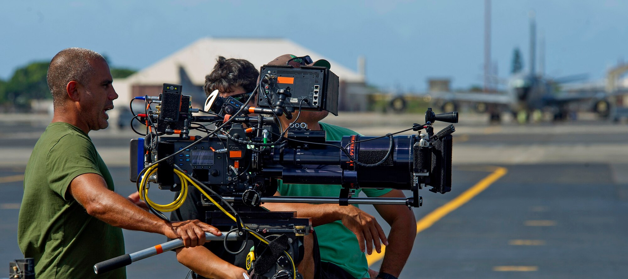 “Hawaii Five-0” camera crew members prepare to film a scene on the flightline at Joint Base Pearl Harbor-Hickam, Oct. 9, 2013. The crew and cast were on scene to shoot a portion of an upcoming episode. (U.S. Air Force photo/Tech. Sgt. Jerome S. Tayborn)