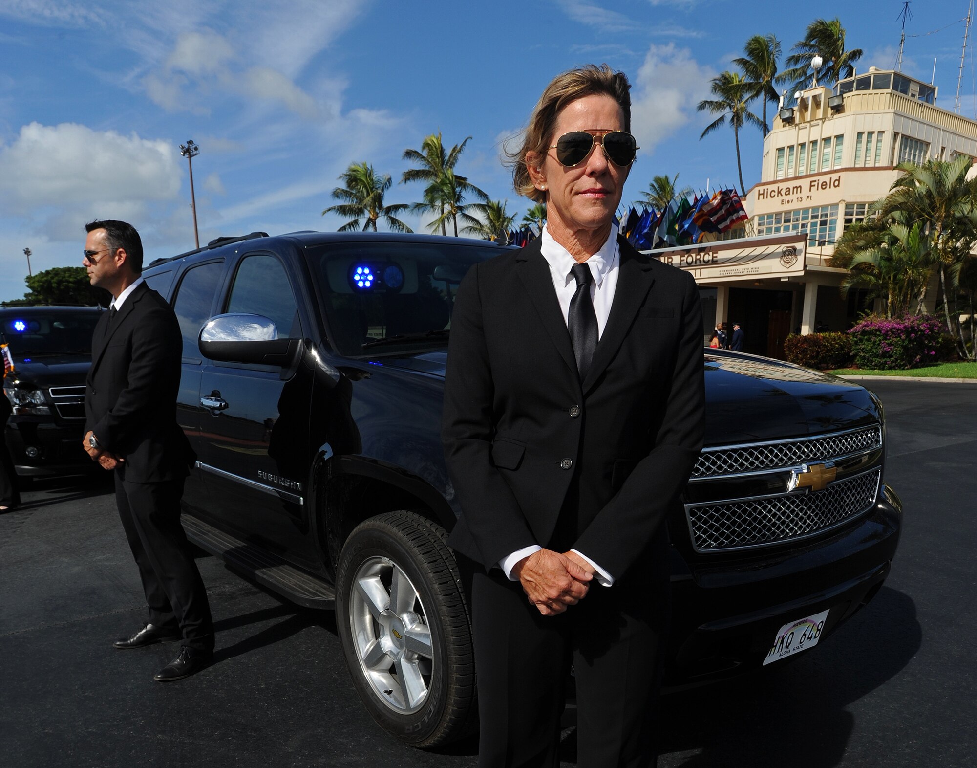 “Hawaii Five-0” actors portraying secret service agents practices a scene during the filming of a portion of “Hawaii Five-0” in front of the Base Operation at Joint Base Pearl Harbor-Hickam, Hawaii, Oct. 9, 2013. The crew and cast were on scene to shoot a portion of an upcoming episode. (U.S. Air Force photo/Tech. Sgt. Jerome S. Tayborn)
