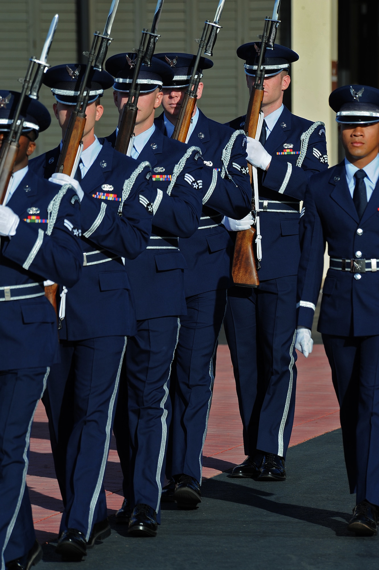 Joint Base Pearl Harbor-Hickam honor guard team practices a scene during the filming of a portion of “Hawaii Five-0,” in front of Base Operation at Joint Base Pearl Harbor-Hickam, Hawaii, Oct. 9, 2013.  The crew and cast were on scene to shoot a portion of an upcoming episode. (U.S. Air Force photo/Tech. Sgt. Jerome S. Tayborn)
