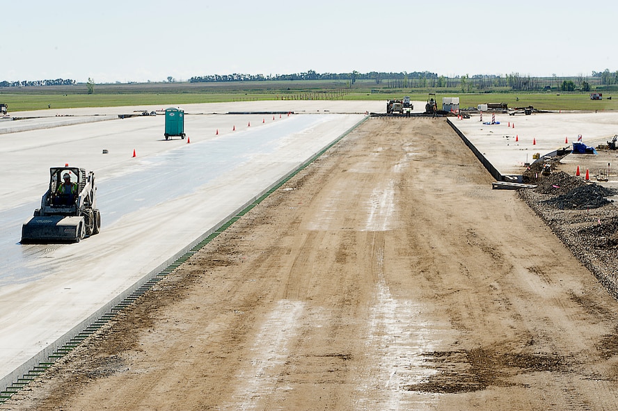 Contractors, in coordination with the U.S. Army Corps of Engineers, are working to complete a full-depth runway repair at Minot Air Force Base, N.D. The runway was constructed in 1957 and work is currently underway for its complete replacement. At the present moment construction workers are fixing the 29-End Keel Section project, which is phase two of a three-phased approach to completely replace the entire runway. (U.S. Air Force photo/Senior Airman Kristoffer Kaubisch)