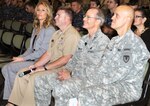 From left: Dr. Heather Ridnour, Comprehensive Soldier & Family Fitness Training Center; Chaplain (Navy Lt. Cmdr.) Joseph Blair, Navy Medical Training Support; Air Force Brig. Gen. Robert LaBrutta, Joint Base San Antonio/502nd  Air Base Wing commander and Army Brig. Gen. Kirk Vollmecke, commanding general, Mission and Installation Contracting Command, listen to Dr. Ed Ahl introduce the agenda for the suicide prevention and awareness seminar, “Shoulder to Shoulder: Ready and Resilient,” held Sept. 20 at the Blesse Auditorium. (Photo by Michael O'Rear, JBSA-Fort Sam Houston Public Affairs)