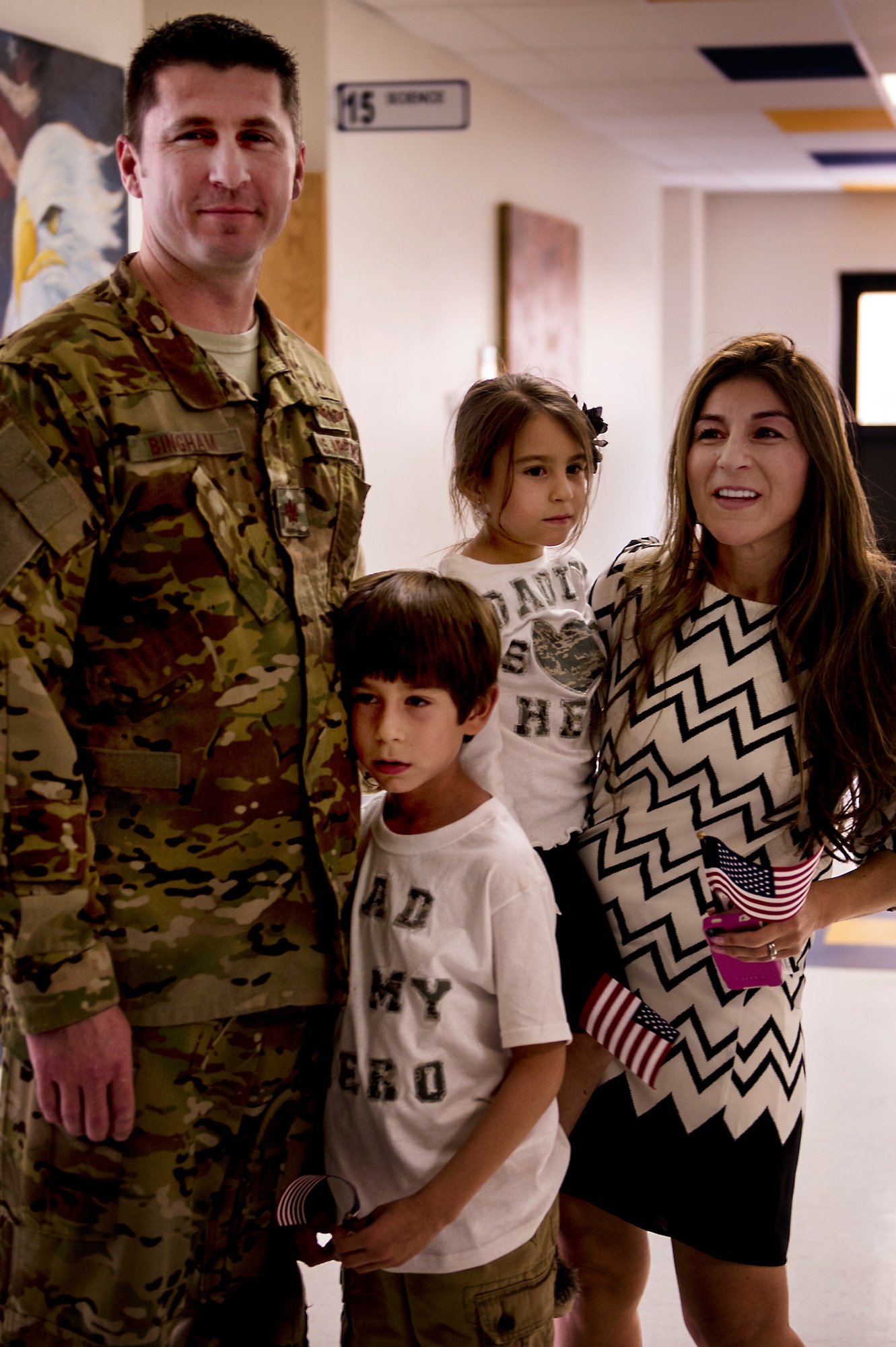 U.S. Air Force Major Robert Bingham reunites with his family after receiving a hero's welcome through the halls of Clovis Christian school Oct. 8, 2013. Bingham's arrival marked the end of a four-month long deployment away from his family to Afghanistan. (U.S. Air Force photo/ Staff Sgt. Matthew Plew)(RELEASED)