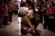 U.S. Air Force Major Robert Bingham reunites with his children Zach and Isabella after receiving a hero's welcome through the halls of Clovis Christian school Oct. 8, 2013. Bingham's arrival marked the end of a four-month long deployment away from his family to Afghanistan. (U.S. Air Force photo/ Staff Sgt. Matthew Plew)(RELEASED)
