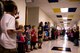 U.S. Air Force Major Robert Bingham receives a hero's welcome as he walks down the halls of Clovis Christian school to surprise his children Oct. 8, 2013. Bingham's arrival marked the end of a four-month long deployment away from his family to Afghanistan. (U.S. Air Force photo/ Staff Sgt. Matthew Plew)(RELEASED)
