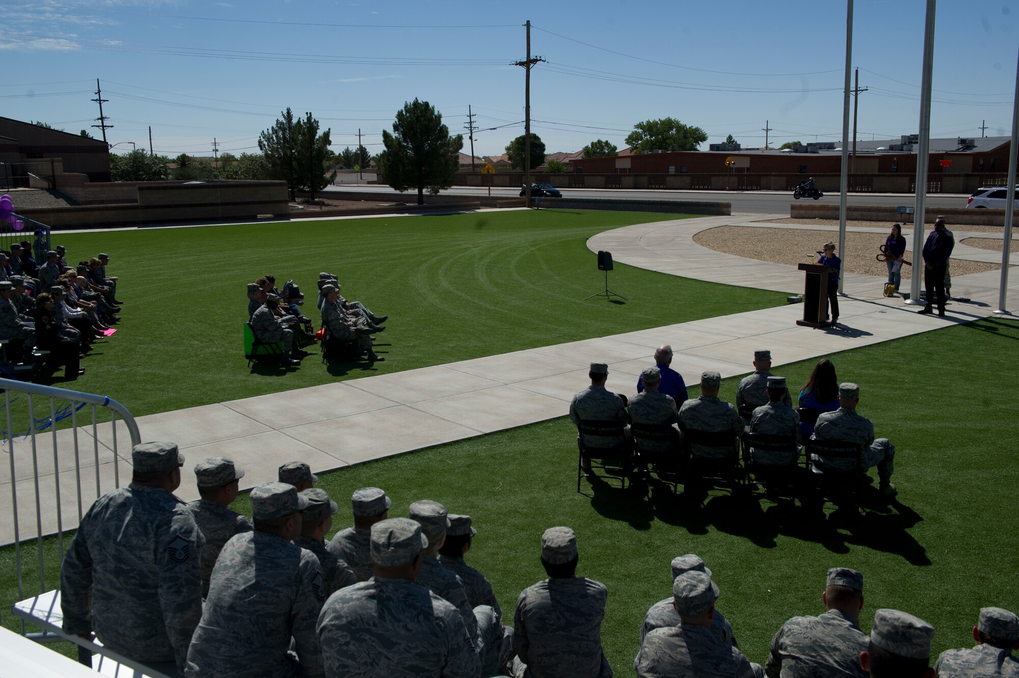 Members of Team Holloman gather at Heritage Park for the opening ceremony of Domestic Violence Awareness Month at Holloman Air Force Base, N.M., Oct. 8. The Family Advocacy Program is sponsoring activities throughout the month of October to promote domestic violence awareness. (U.S. Air Force Photo by Airman 1st Class Chase Cannon/Released)