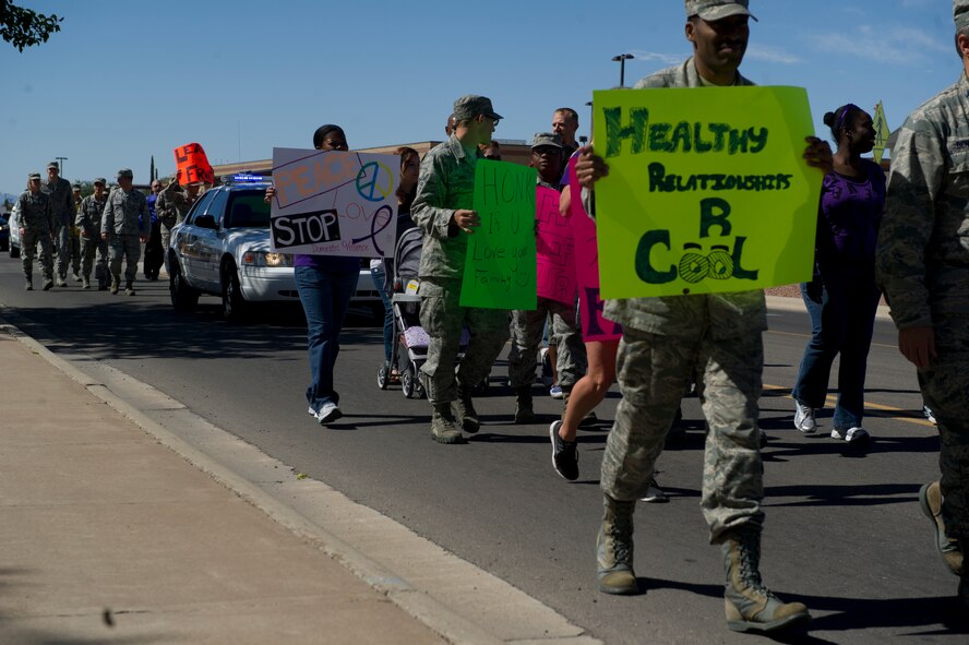 Members of Team Holloman march from Holloman Air Force Base, N.M., Commissary parking lot to Heritage Park in honor of Domestic Violence Awareness Month Oct. 8. The Family Advocacy Program is sponsoring activities throughout the month of October to promote domestic violence awareness. (U.S. Air Force Photo by Airman 1st Class Chase Cannon/Released)