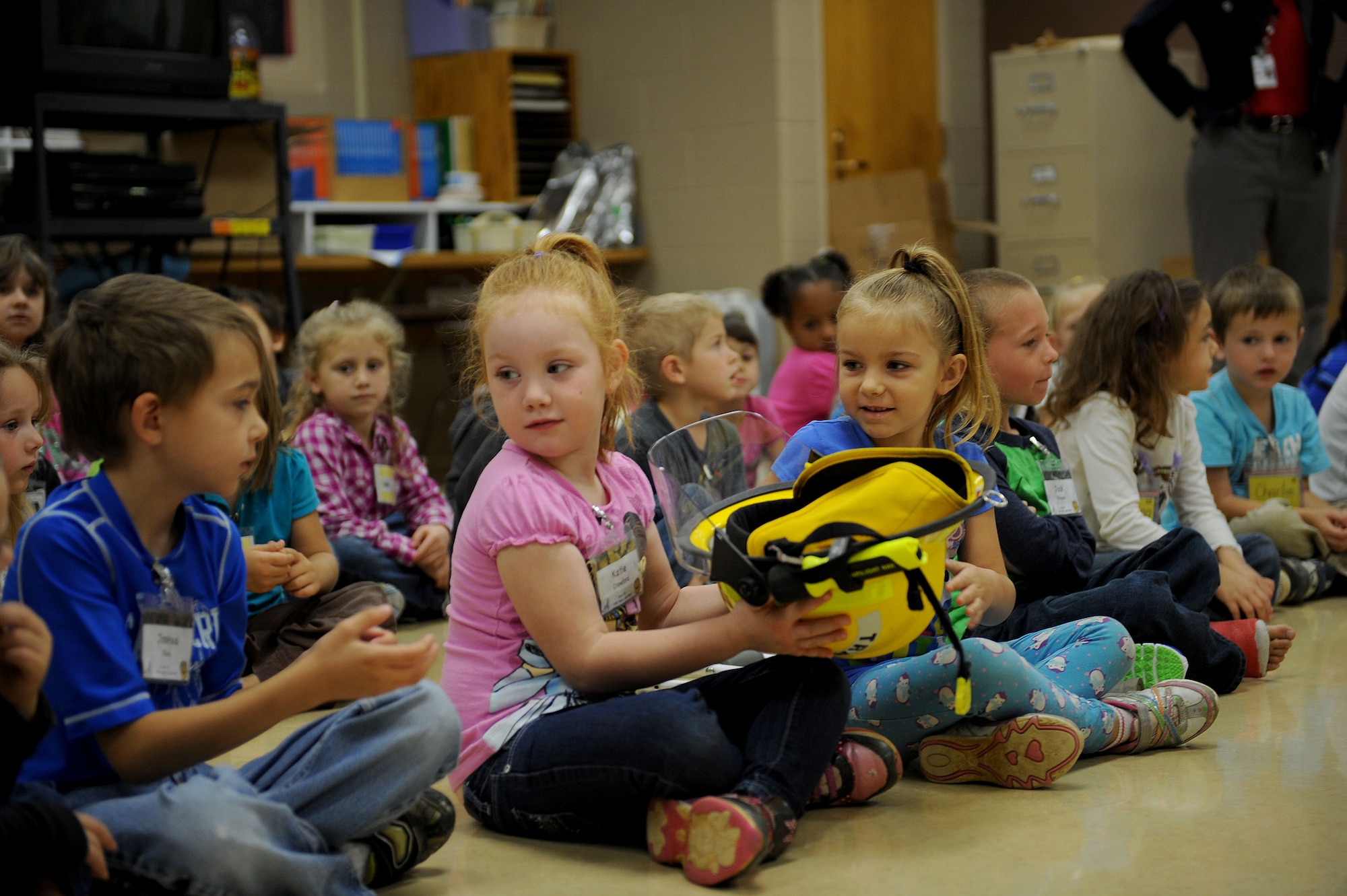 Kindergarten students get a close look at firefighting equipment during a fire prevention presentation at Badger Clark Elementary School in Box Elder, S.D. Oct. 3, 2013. Each year, Ellsworth firefighters visit local schools during National Fire Prevention Week in an effort to increase fire safety awareness. (U.S. Air Force photo by Airman 1st Class Rebecca Imwalle/Released)