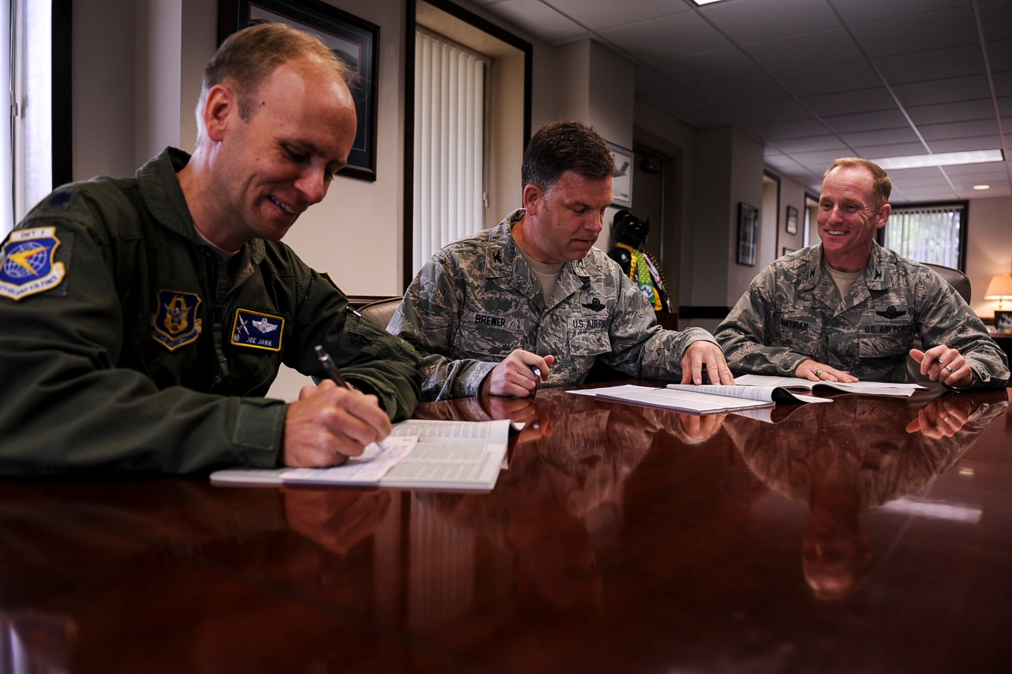 From left, Lt. Col. Joseph Janik, 22nd Air Force Detachment 1 Operations commander, Col. Edward Brewer, 314th Airlift Wing commander and Col. Patrick Rhatigan, 19th Airlift Wing commander, fill out their Combined Federal Campaign donation cards Oct. 1, 2013, at Little Rock Air Force Base, Ark. Last year the CFC raised $258.3 million to donate to charities nationally, internationally, locally as well as right here at Little Rock Air Force Base. (U.S. Air Force photo by Airman 1st Class Cliffton Dolezal)