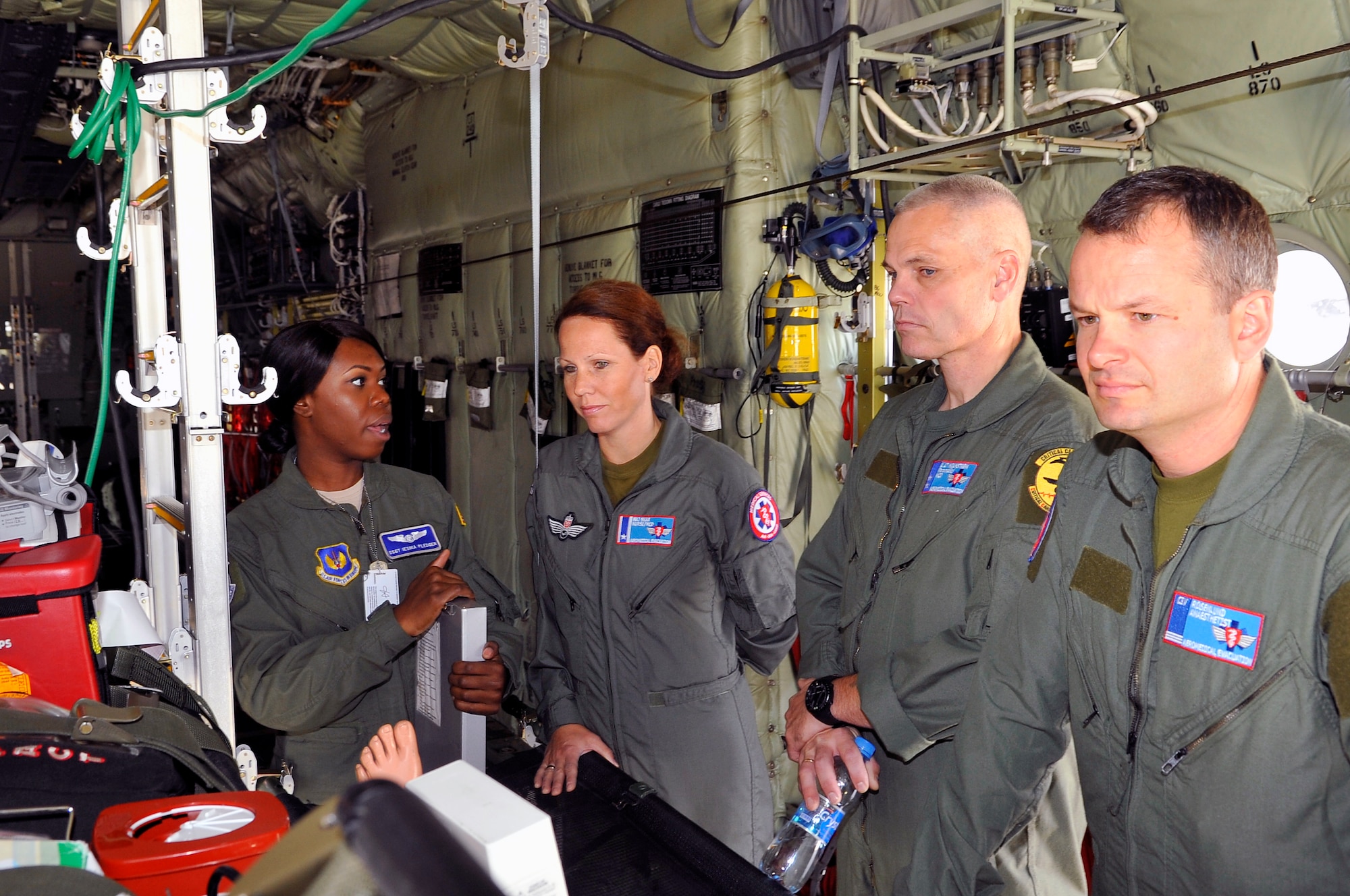 Staff Sgt. Ieshia Pledger, 86th Aeromedical Evacuation Squadron aircrew training flight instructor, explains the equipment and procedures used for AE missions to members of the Norwegian medical branch during a tour, Oct. 3, 2013, Ramstein Air Base, Germany. The medical branch visited the CASF, Landstuhl Regional Medical Center and other medical agencies to learn how the U.S. performs aeromedical evacuation and critical care aeromedical transport missions. (U.S. Air Force photo/Senior Airman Trevor Rhynes)