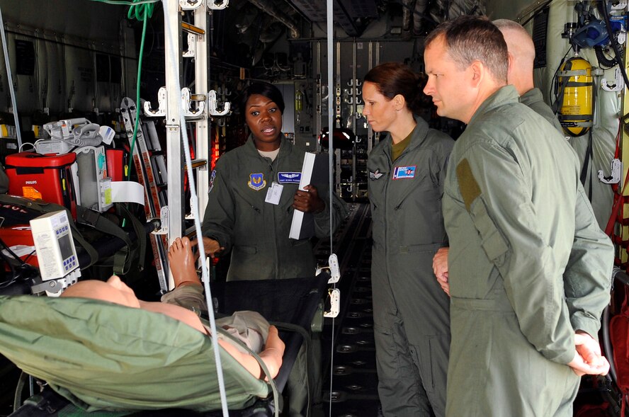Staff Sgt. Ieshia Pledger, 86th Aeromedical Evacuation Squadron AE specialist, explains the equipment and procedures for AE missions to members of the Norwegian medical branch during a tour, Oct. 3, 2013, Ramstein Air Base, Germany. The medical branch visited the Contingency Aeromedical Staging Facility, Landstuhl Regional Medical Center and other medical agencies to learn how the U.S. performs aeromedical evacuation and critical care aeromedical transport missions. (U.S. Air Force photo/Senior Airman Trevor Rhynes)