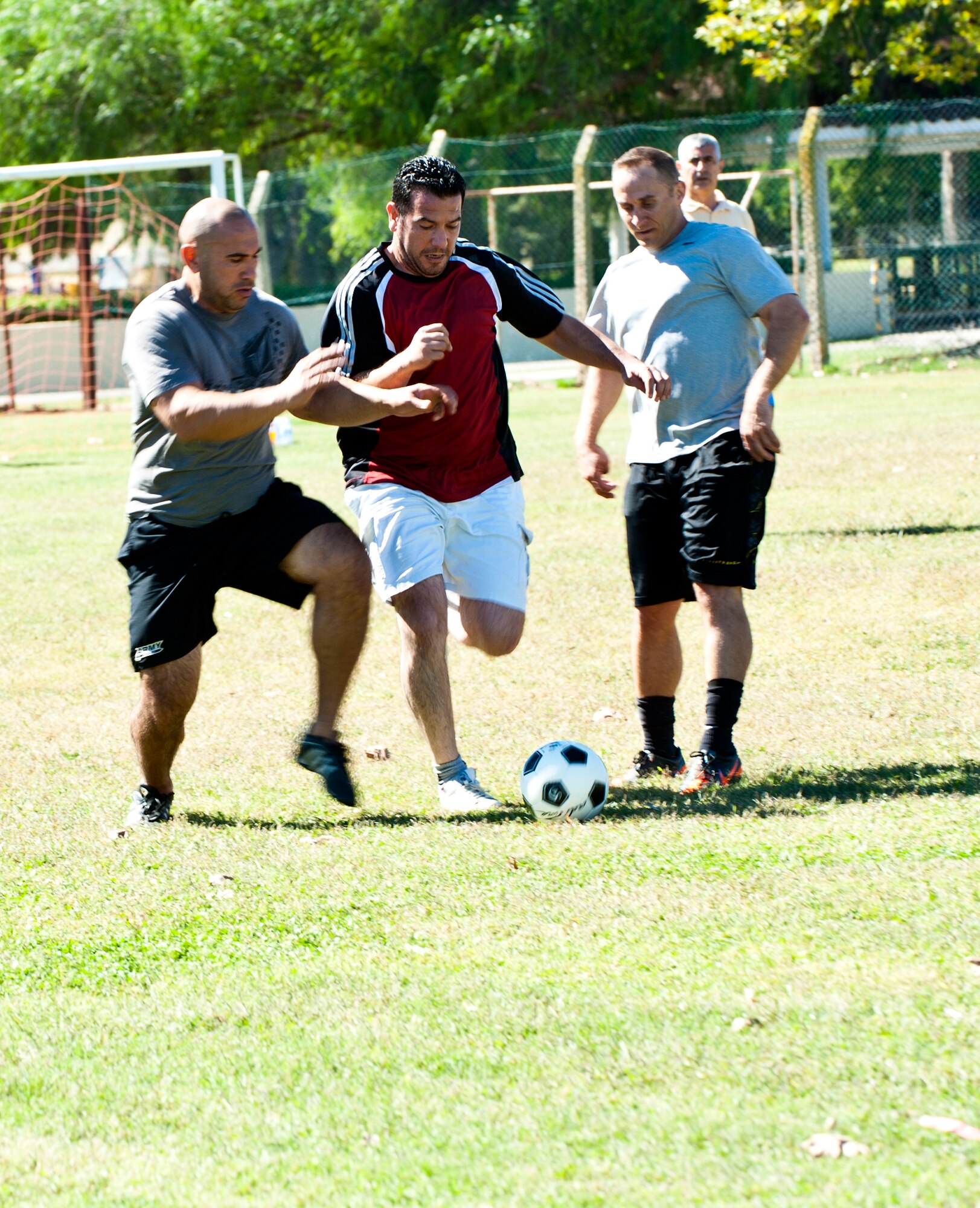 Players fight for the ball during a 39th Logistics Readiness Squadron soccer game at Arkadas Park Oct. 7, 2013, at Incirlik Air Base, Turkey. Soccer is commonly called football by many nations across the world. (U.S. Air Force photo by Senior Airman Daniel Phelps/Released)
