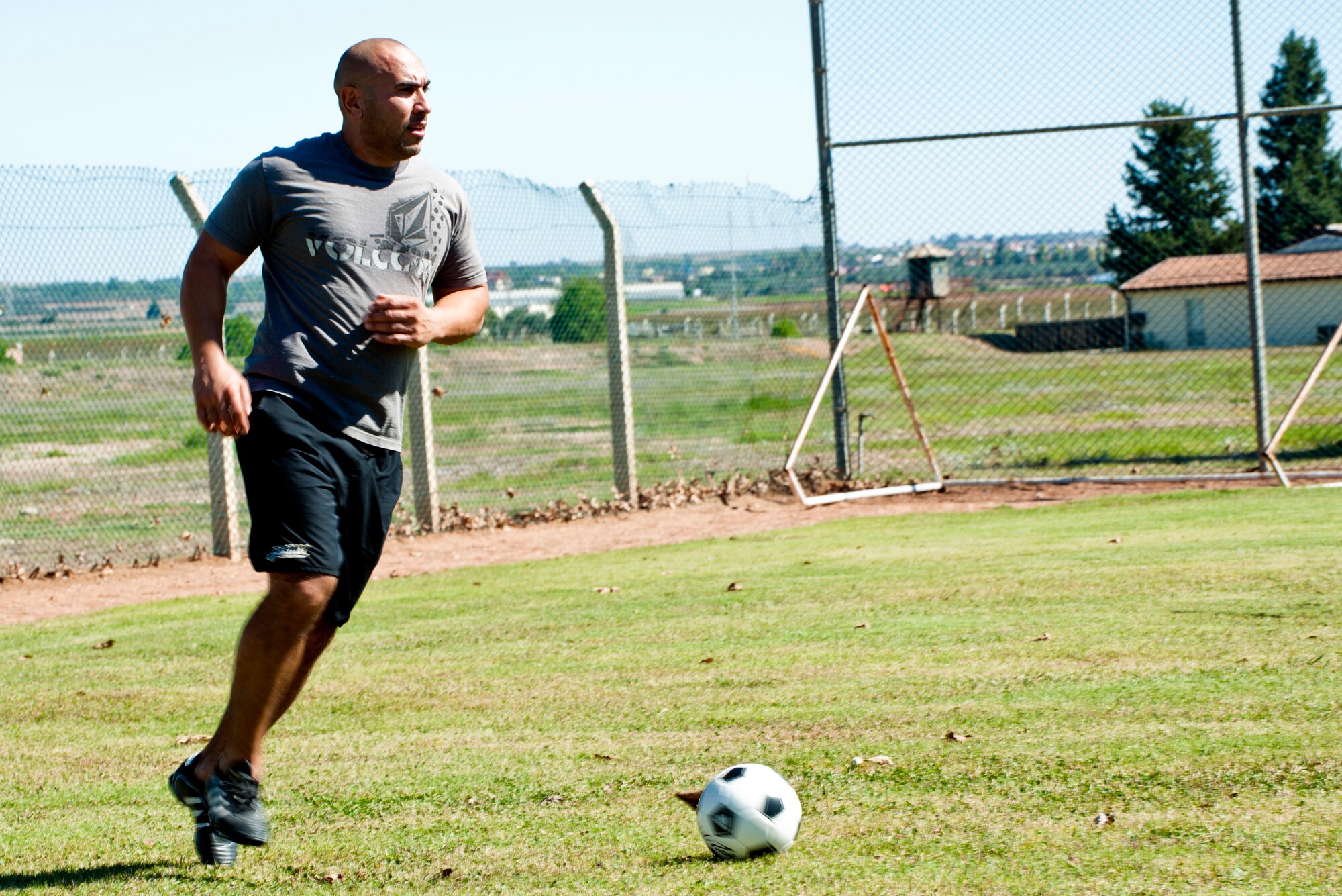 Ahmet Kocacay prepares to launch the ball down the field during a 39th Logistics Readiness Squadron soccer game at Arkadas Park Oct. 7, 2013, at Incirlik Air Base, Turkey. Events such as soccer games and barbeques are held by the 39th LRS to help strengthen the cross-cultural bond between the Turkish and Americans on Incirlik AB. (U.S. Air Force photo by Senior Airman Daniel Phelps/Released)