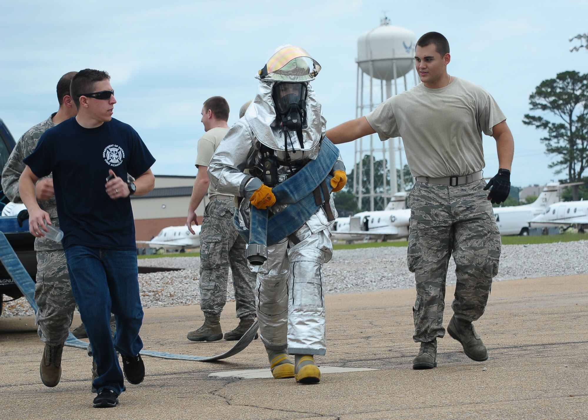 Lt. Col. Amy Woosley, 14th Medical Support Squadron Commander, participates in the 300 foot three-inch hose pull competition at the Commanders vs. First Sergeants Fire Muster Competition Oct. 9 at the Fire Station. (U.S. Air Force Photo/Airman Daniel Lile)