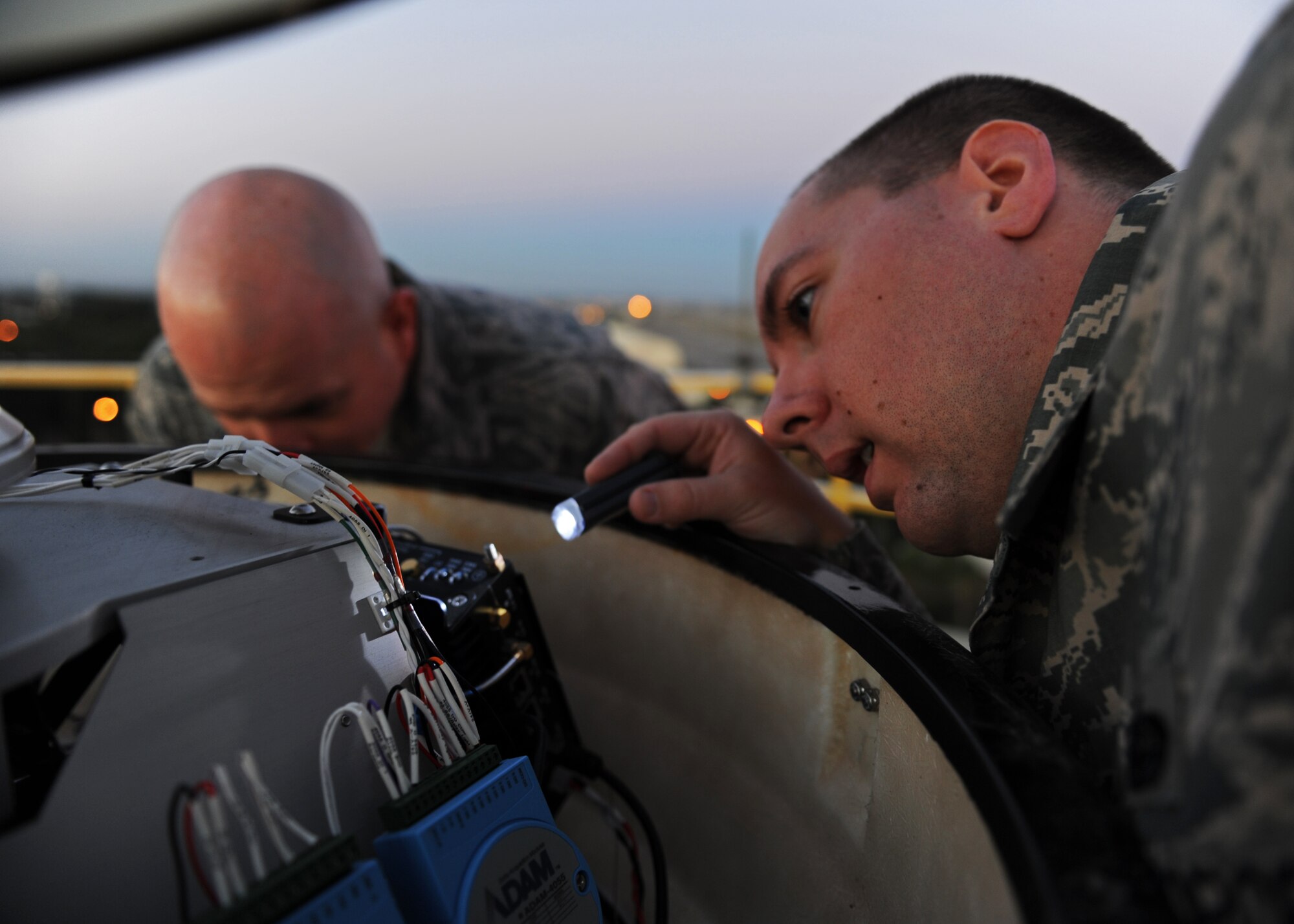Staff Sgt. Eric Vincent, 39th Communications Squadron ground radar systems technician, peers closely at components of the Portable Doppler Radar Oct. 10, 2013, at Incirlik Air Base, Turkey. The radar is one of two of its kind in the U.S. Air Forces in Europe major command. (U.S. Air Force photo/Senior Airman Chase Hedrick)