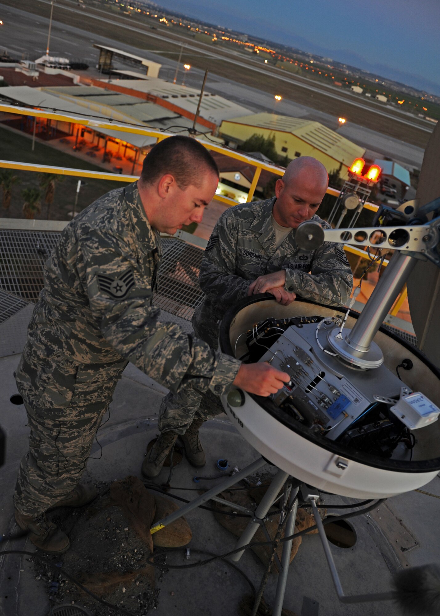 Staff Sgt. Eric Vincent, 39th Communication Squadron ground radar systems technician explains elements of the Portable Doppler Radar to Tech. Sgt. Joe-Ben Dorbant, 39th Operations Squadron weather section chief, Oct. 10, 2013, at Incirlik Air Base, Turkey. The weather radar is the only Doppler radar system in the Adana region. (U.S. Air Force photo/Senior Airman Chase Hedrick)