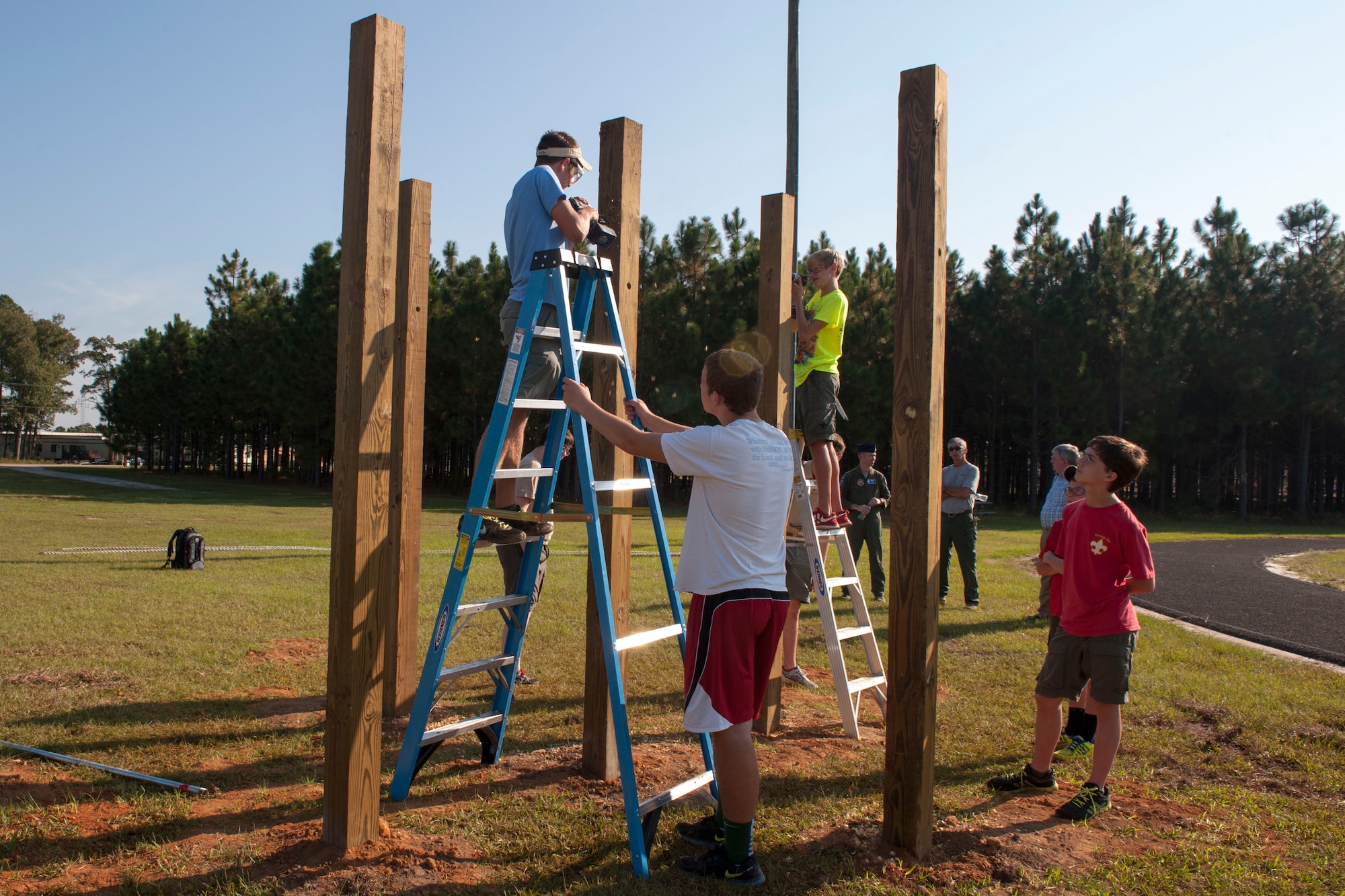 Boy Scouts with Troop 95 from Irmo, S.C., build pull-up bars at McEntire Joint National Guard Base, S.C., as part of their Eagle Scout project with help of the 169th Civil Engineer Squadron, Oct. 5, 2013.  The project is a leadership task and final step before earning Eagle Scout. (U.S. Air National Guard photo by Staff Sgt. Jorge Intriago/Released) 