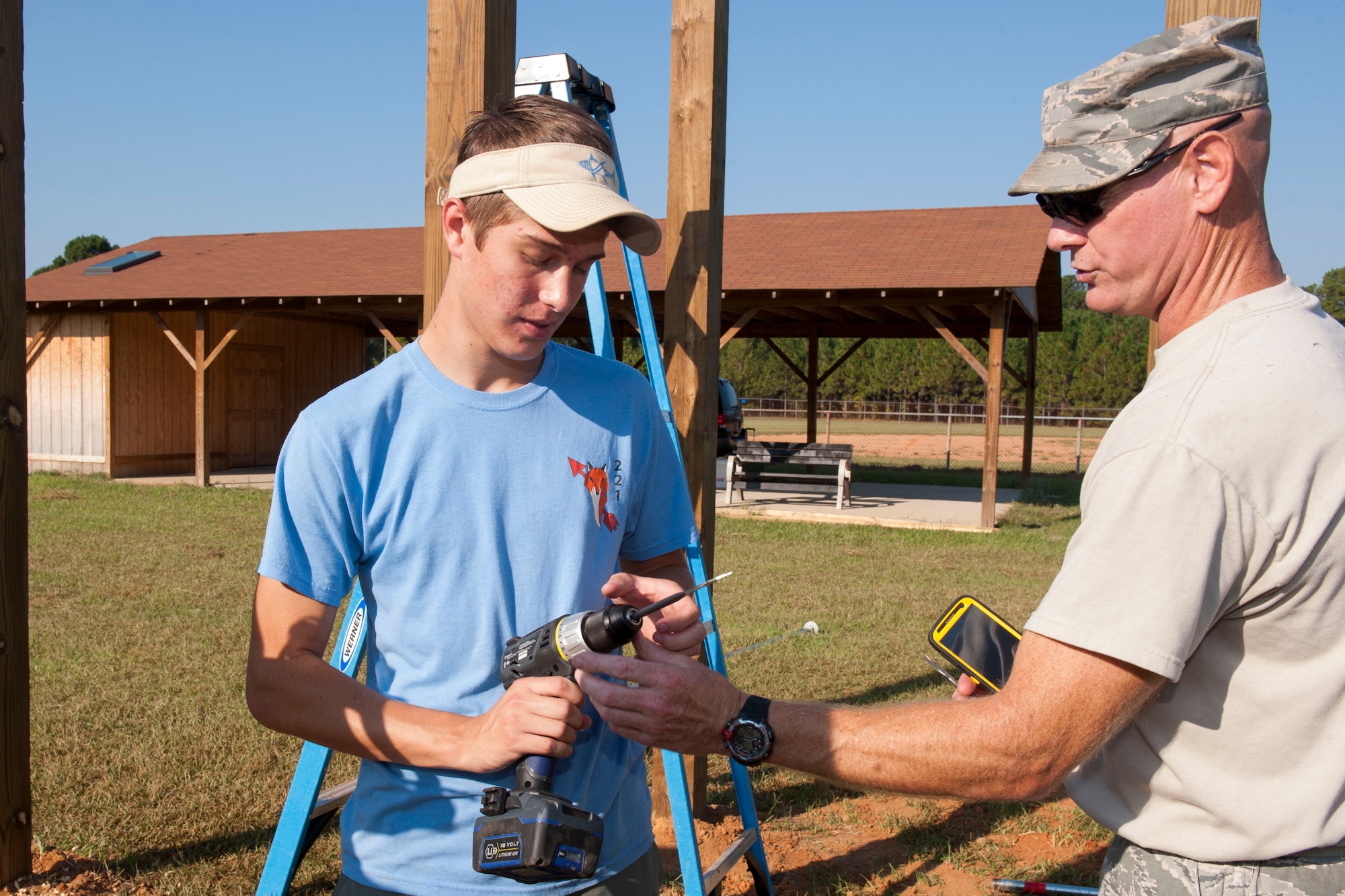 Boy Scouts with Troop 95 from Irmo, S.C., build pull-up bars at McEntire Joint National Guard Base, S.C., as part of their Eagle Scout project with help of the 169th Civil Engineer Squadron, Oct. 5, 2013.  The project is a leadership task and final step before earning Eagle Scout. (U.S. Air National Guard photo by Staff Sgt. Jorge Intriago/Released) 